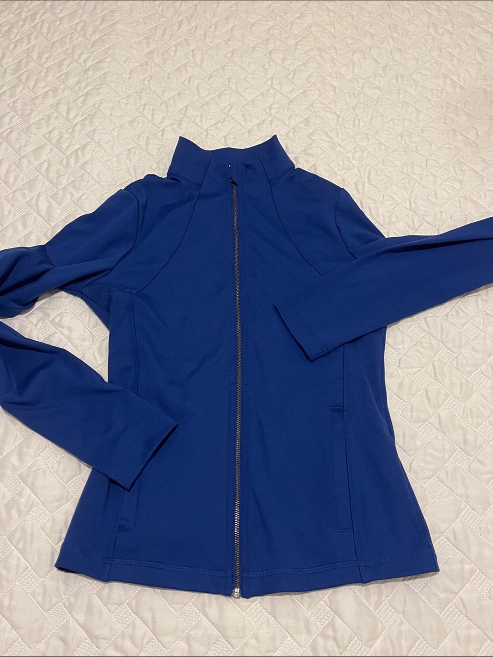 Two Gilly Hicks blue and grey zip up jackets.